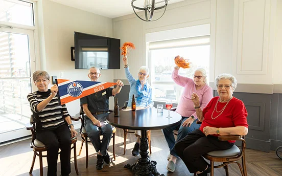 group cheering for a edmonton oilers